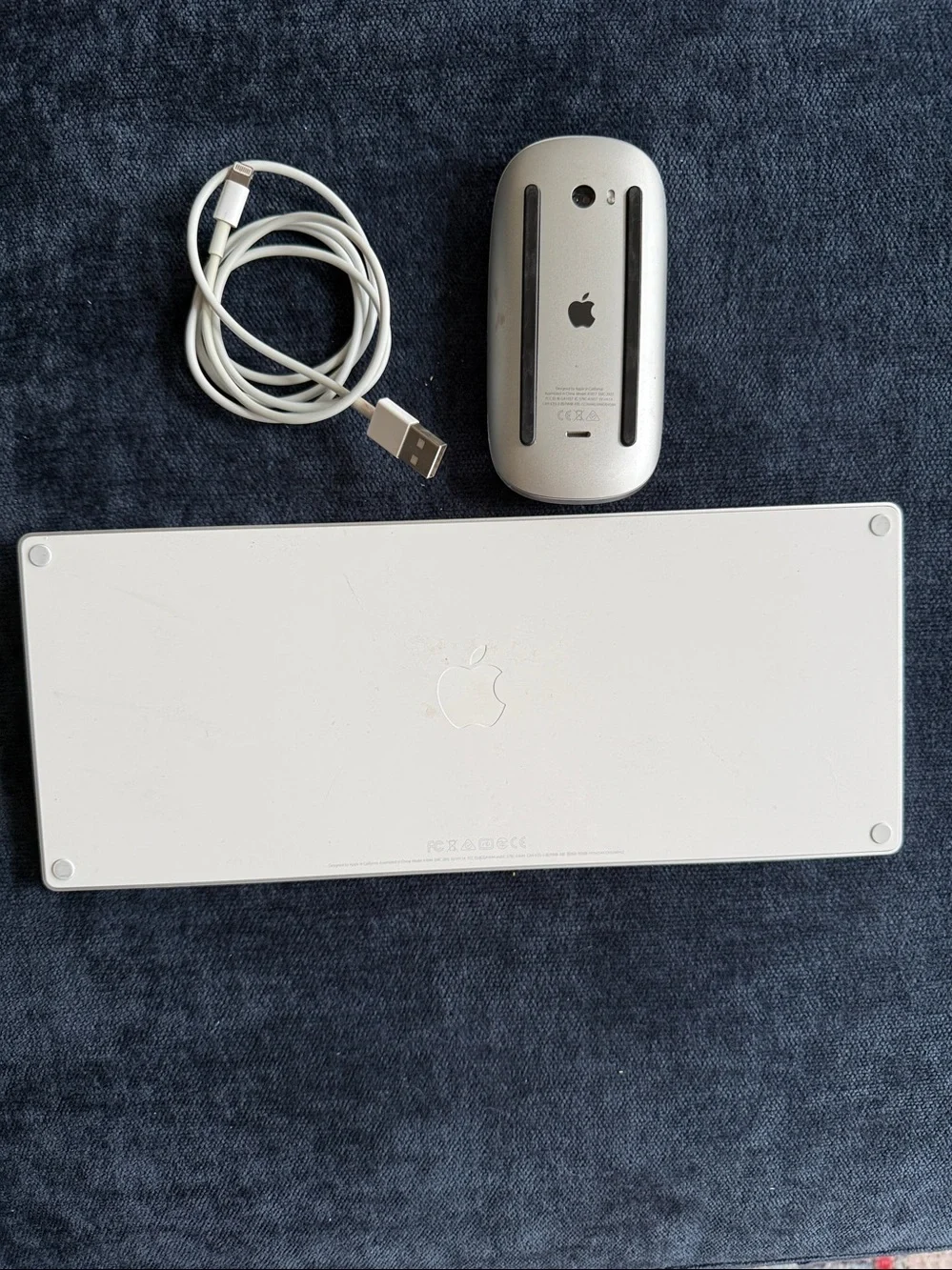 Apple Magic Keyboard and mouse with charging cable. Both are wireless